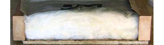 What is Insulation? - Fiberglass insulation traps air between tiny glass fibers